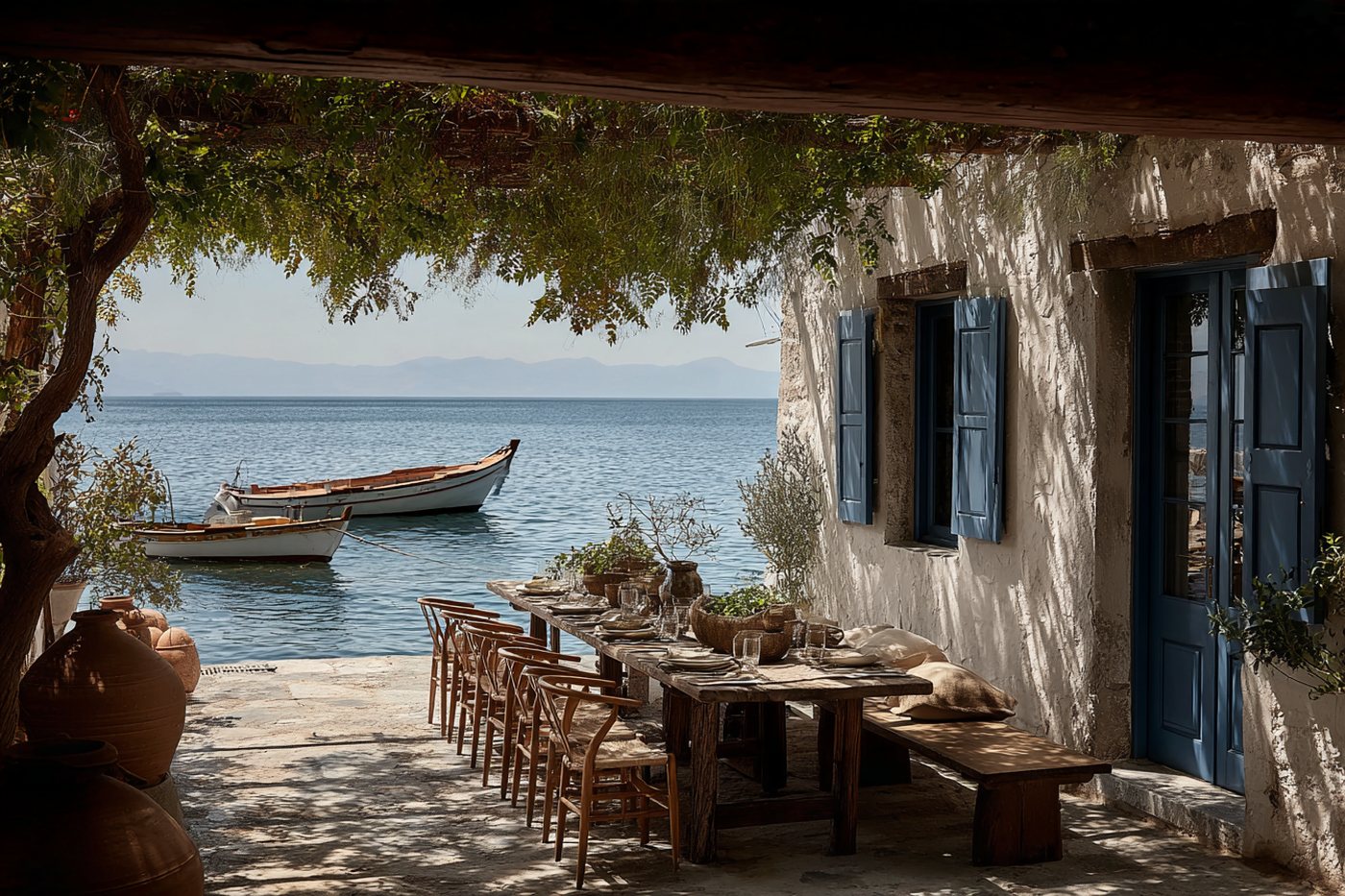 Taverna terrace on the harbour under a vine pergola, set for a long lunch